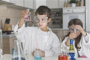 Boy & Girl doing Chemistry experiment