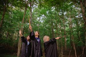 Children dressed up as wizards in the forest