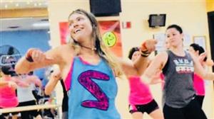 People participating in Zumba Gold, smiling and exercising