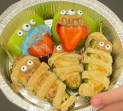 Food is made to look like mummies wrapped up with spooky eyes sticking out