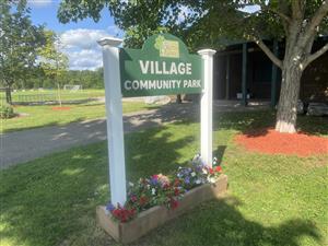 Entrance sign at Village Community Park