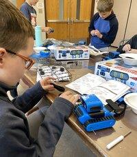 Campers work on building their RECO Robots