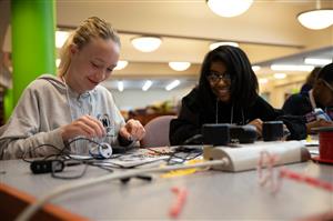 Campers work together on a engineering project