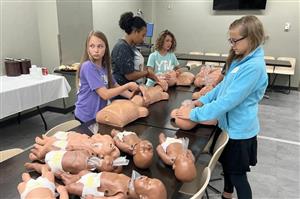 4 girls with baby dolls