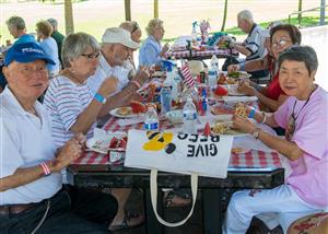 Seniors enjoying a BBQ meal