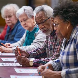 A group of seniors enjoy a game of bingo together 